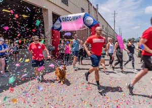 associates run through confetti