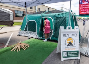 Associate looks at rental tent