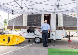 associate looks at rental camper