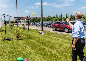 associate plays a toss game