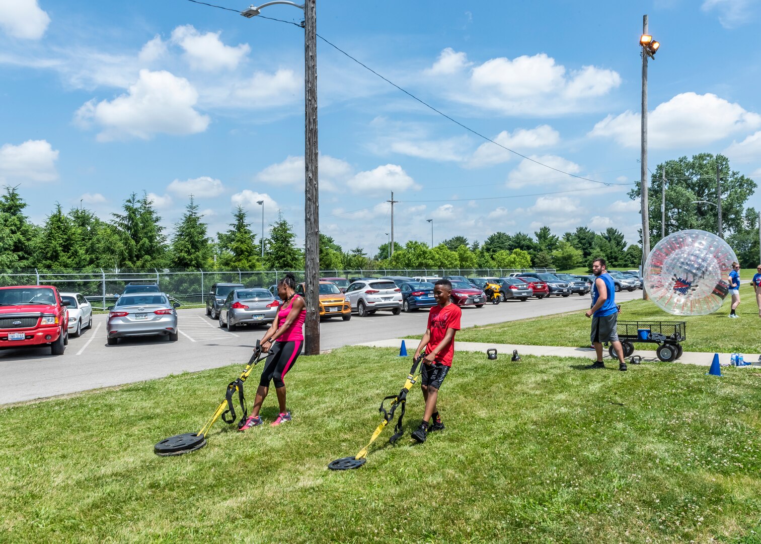 people pulling exercise disc