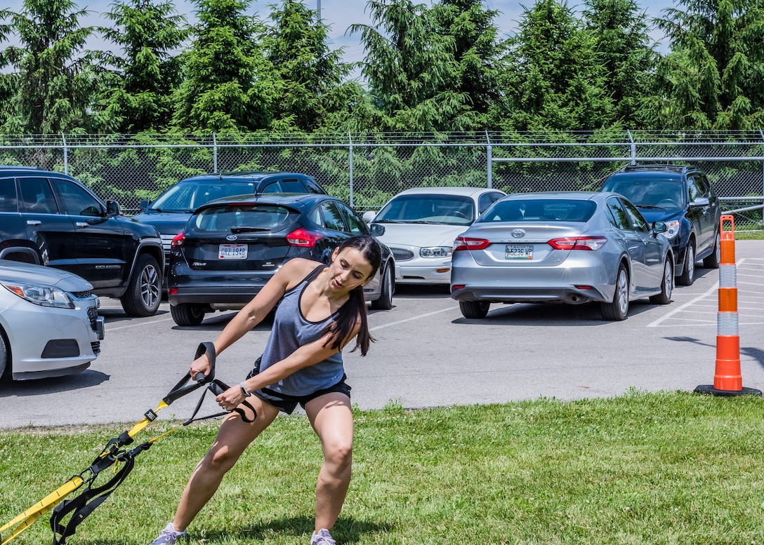 woman pulling exercise equipment