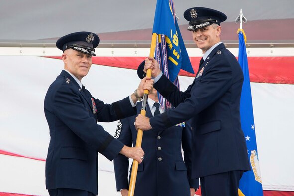 Lt. Gen. Steve Kwast, commander of Air Education and Training Command, passes the 19th Air Force guidon to Maj. Gen. Craig Wills, during the 19th Air Force change of command ceremony June 13, 2019, at Joint Base San Antonio-Randolph, Texas.  The numbered Air Force oversees 19 training locations, with 17 Total Force wings, 11 active duty, one Air Force Reserve and five Air National Guard units.  More than 32,000 members of the 19th Air Force operate more than 1,600 aircraft from 29 different aircraft models. (U.S. Air Force photo by Sean M. Worrell)