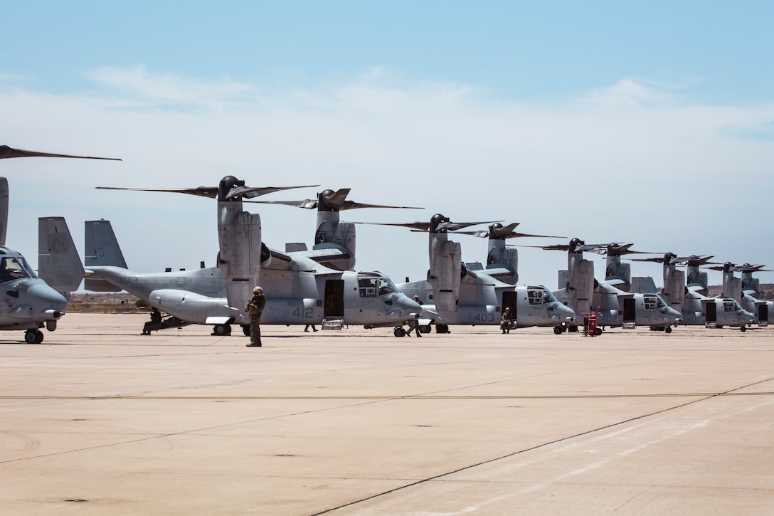 MV-22B Ospreys and Marines with Marine Medium Tiltrotor Squadron (VMM) 764, 4th Marine Aircraft Wing, lineup on the flight line before taking off from Marine Corps Air Station Miramar, Calif., June 12. Once a year reserve components of the Marine Corps go on two-week annual training detachments to sharpen their skills in their military occupational specialties. (U.S. Marine Corps photo by Sgt. Becky Cleveland)
