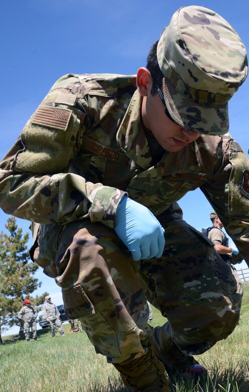 Senior Airman Ramiro Crespo, 341st Force Support Squadron customer service apprentice, participates in a search and recovery exercise June 12, 2019, at Malmstrom Air Force Base, Mont. The Airmen were required to wear personal protective equipment as they would in real life including, but not limited to, steel-toe boots or toe-caps; and various chemical, biological, radiological and nuclear warfare protective items. (U.S. Air Force photo by Staff Sgt. Magen M. Reeves)