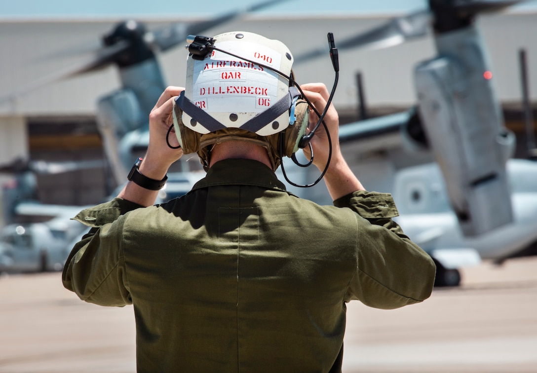 A Marine with Marine Medium Tiltrotor Squadron (VMM) 764, 4th Marine Aircraft Wing, stands on the flight line before the MV-22B Ospreys take off from Marine Corps Air Station Miramar, Calif., June 12. Once a year reserve components of the Marine Corps go on two-week annual training detachments to sharpen their skills in their military occupational specialties. (U.S. Marine Corps photo by Sgt. Becky Cleveland)