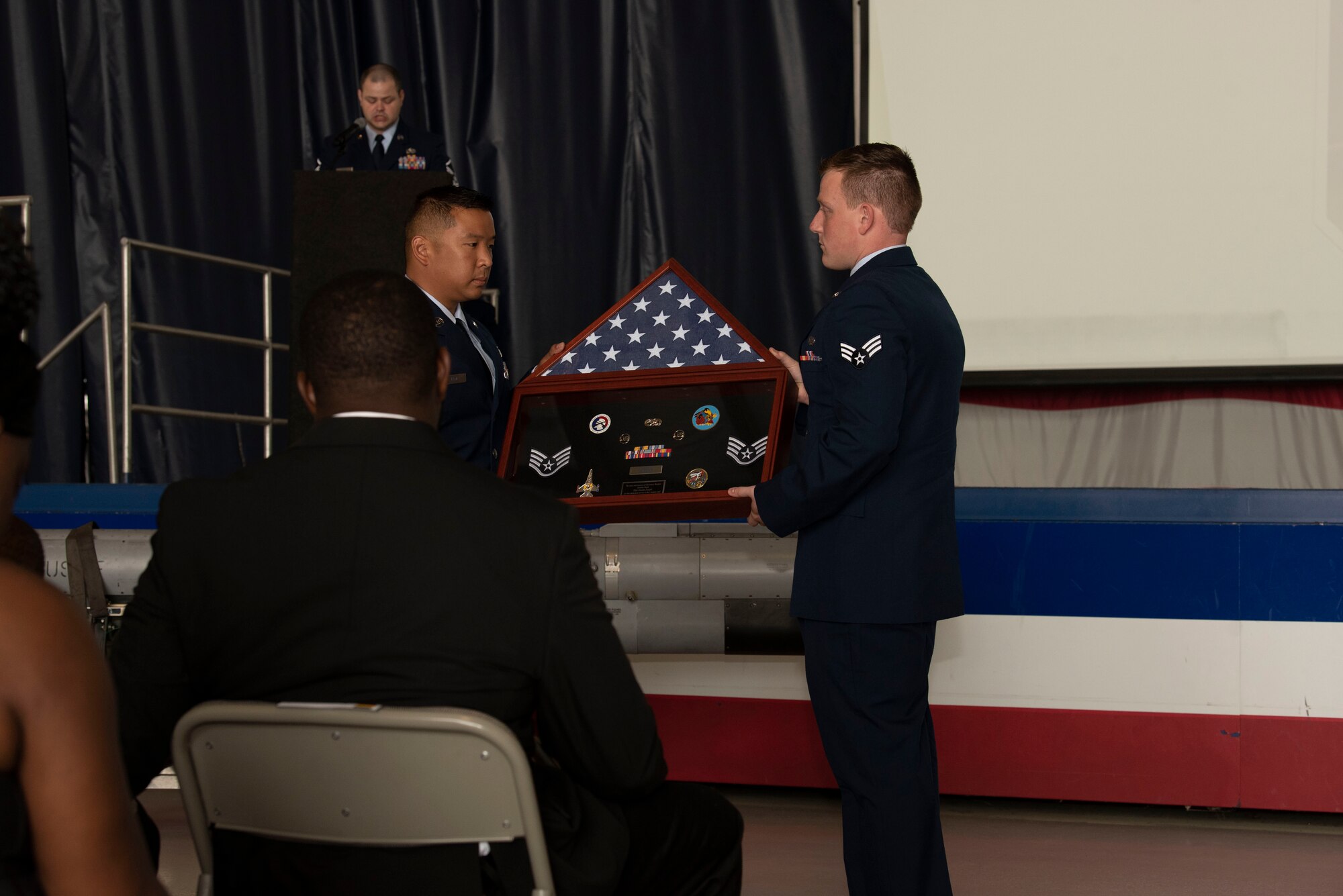 U.S. Air Force Staff Sgt. Amalia Joseph’s, 20th Component Maintenance Squadron electronic warfare journeyman, shadow box is presented to her husband during a memorial service at Shaw Air Force Base, South Carolina, June 7, 2019