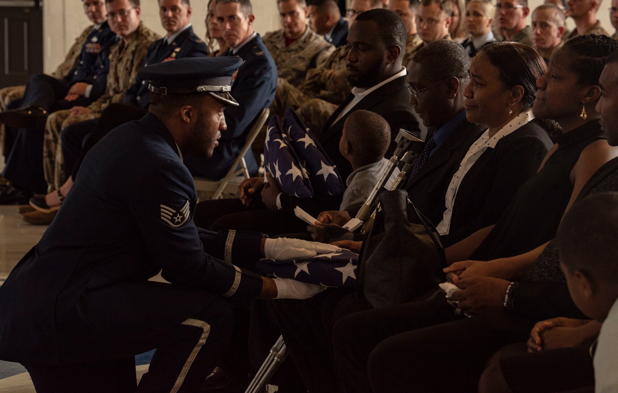 The American flag is presented to the son of Staff Sgt. Amalia Joseph, 20th Component Maintenance Squadron electronic warfare journeyman, during a memorial service at Shaw Air Force Base, South Carolina, June 7, 2019.