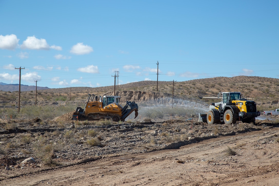 Contractors use water to control the dust created as they work to remove contaminated soil during an Installation Restoration project aboard Marine Corps Logistics Base Barstow, Calif., May 21.