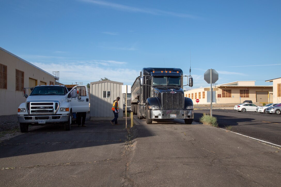 Crews weigh in trucks before and after being loaded with dirt being removed from an Installation Restoration site aboard Marine Corps Logistics Base Barstow, Calif., May 21.