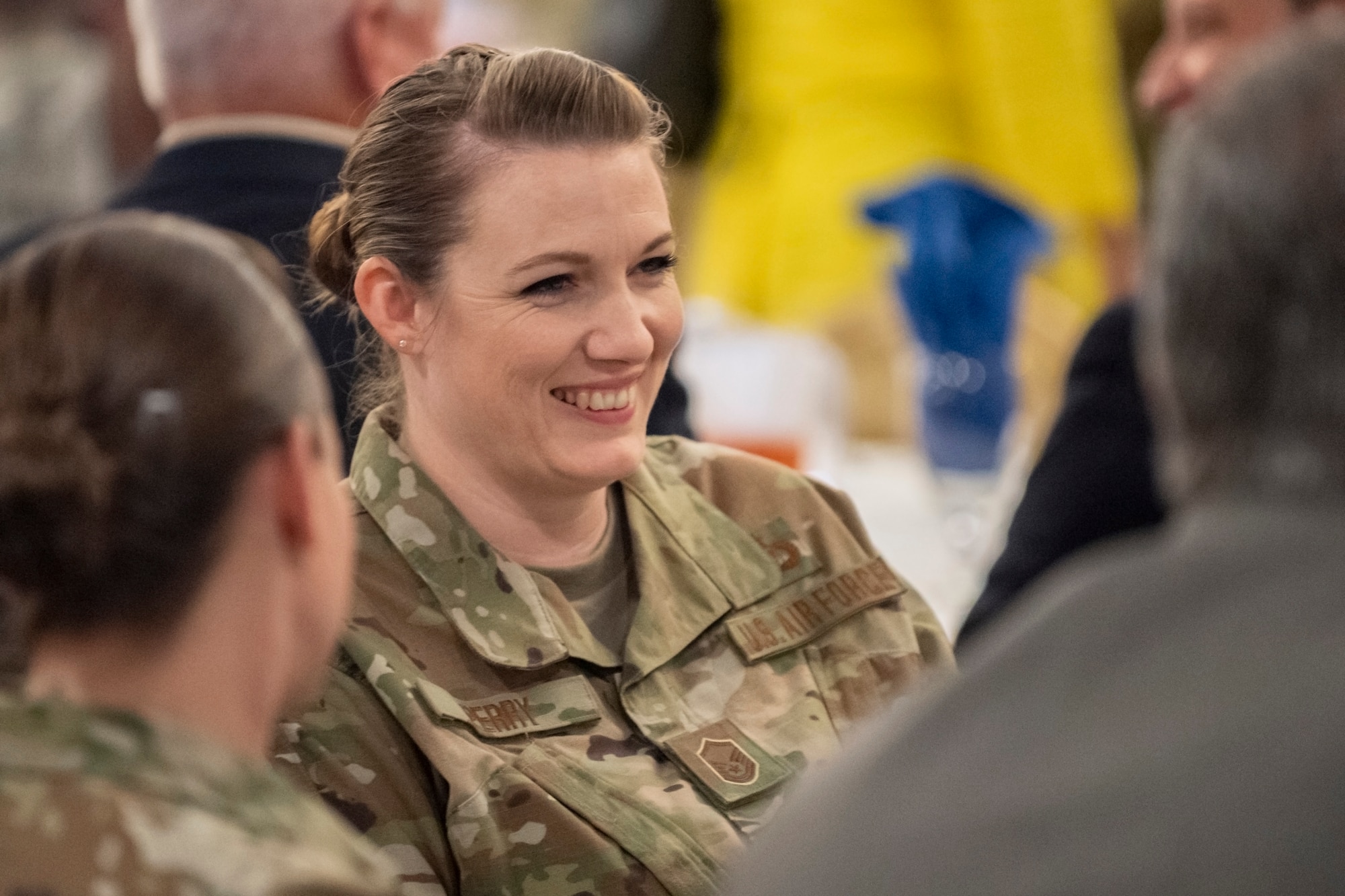 U.S. Air Force Master Sgt. Amber Perry, an inspections coordinator for the 307th Bomb Wing Inspector General, speaks with other guests during the Shreveport Bossier Military Affairs Council quarterly update luncheon at Barksdale Air Force Base, Louisiana, June 12, 2019. Perry earned a 2019 MAC scholarship, which she will use to achieve her bachelor's degree in emergency and disaster management. (U.S. Air Force photo by Senior Airman Maxwell Daigle)