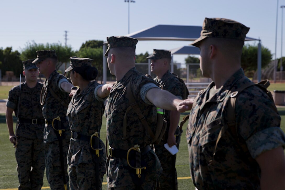 U.S. Marines stationed at Marine Corps Air Station Yuma practice conducting Sword Manual and drill as part of their corporals course curriculum at MCAS Yuma Ariz., May 7, 2019. Corporals Course is a leadership class designed to teach Marines the fundamentals of being a noncommissioned officer. (U.S. Marine Corps photo by Lance Cpl. Joel Soriano)