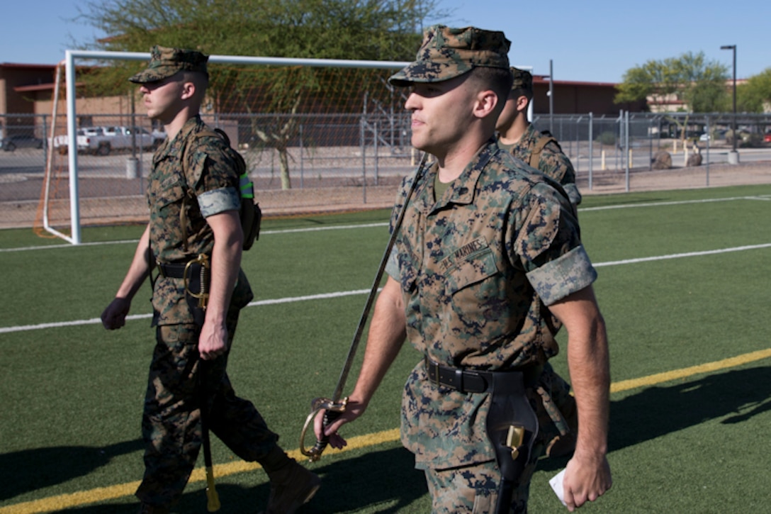 U.S. Marines stationed at Marine Corps Air Station Yuma practice conducting Sword Manual and drill as part of their corporals course curriculum at MCAS Yuma Ariz., May 7, 2019. Corporals Course is a leadership class designed to teach Marines the fundamentals of being a noncommissioned officer. (U.S. Marine Corps photo by Lance Cpl. Joel Soriano)