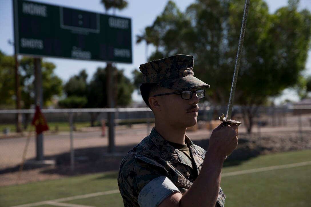 U.S. Marines stationed at Marine Corps Air Station Yuma practice conducting Sword Manual and drill as part of their corporals course curriculum at MCAS Yuma Ariz., May 7, 2019. Corporals Course is a leadership class designed to teach Marines the fundamentals of being a noncommissioned officer. (U.S. Marine Corps photo by Lance Cpl. Joel Soriano)