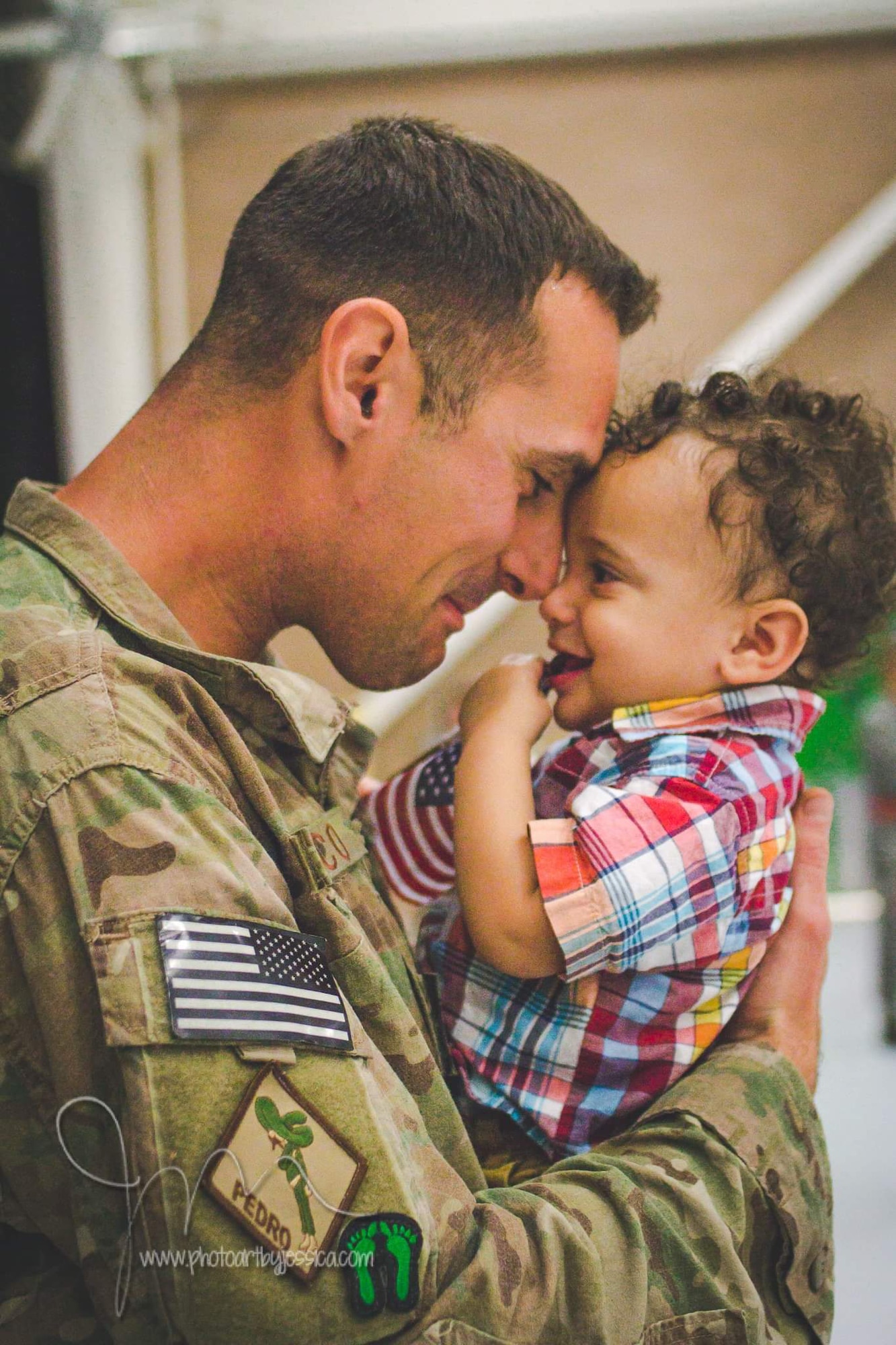U.S. Air Force Tech. Sgt. Joshua Cunico, 373rd Training Squadron military training unit flight chief, holds back tears when he sees his child, Joshua Jr., 1, after returning from a deployment to Afghanistan in October 2014 at Davis-Monthan Air Force Base, Arizona. Cunico and his family cherish Father’s Day this year because they get to spend it together. Cunico has deployed twice since becoming a dad in 2014. (Courtesy photo)