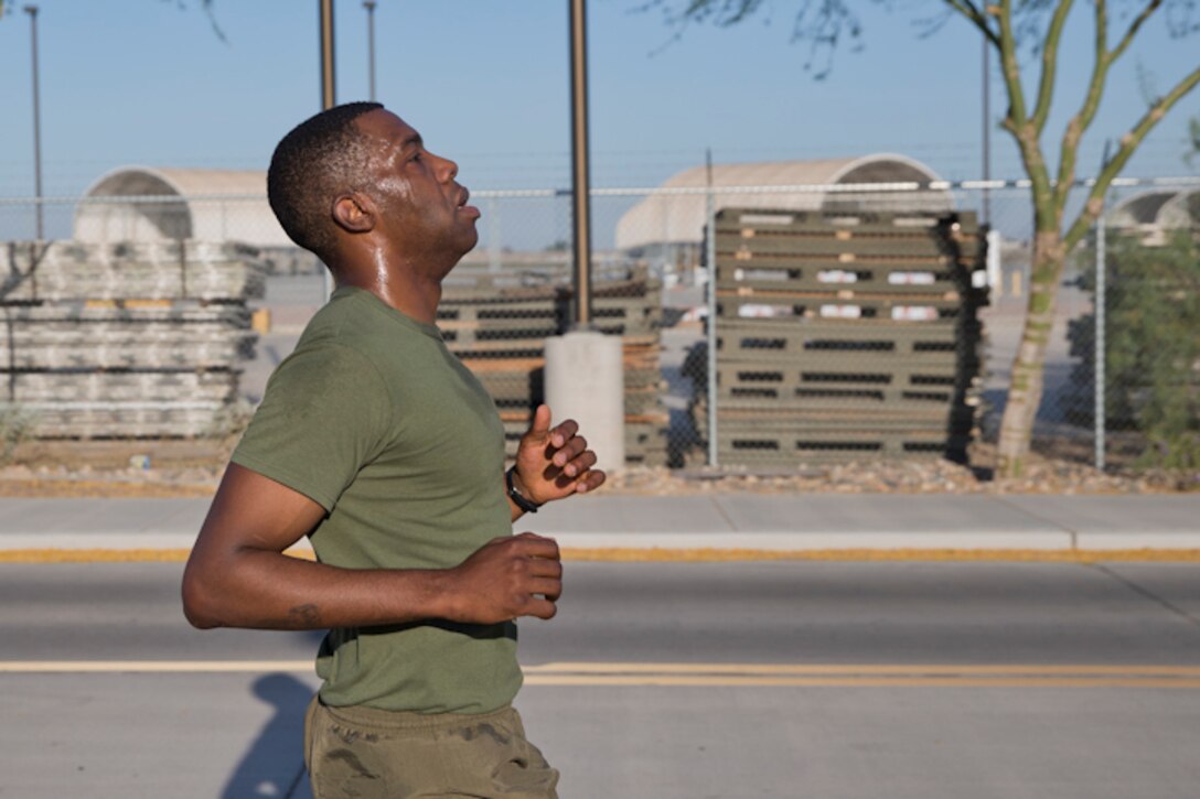 U.S. Marines with Headquarters and Headquarters Squadron, Marine Corps Air Station Yuma, conduct the pull-up portion of the Physical Fitness Test (PFT) at Marine Corps Air Station Yuma Ariz., May 8, 2019. The PFT is an annual requirement for all Marines, and consists of pull-ups, crunches, and a 3 mile run. (U.S. Marine Corps photo by Lance Cpl. Joel Soriano)