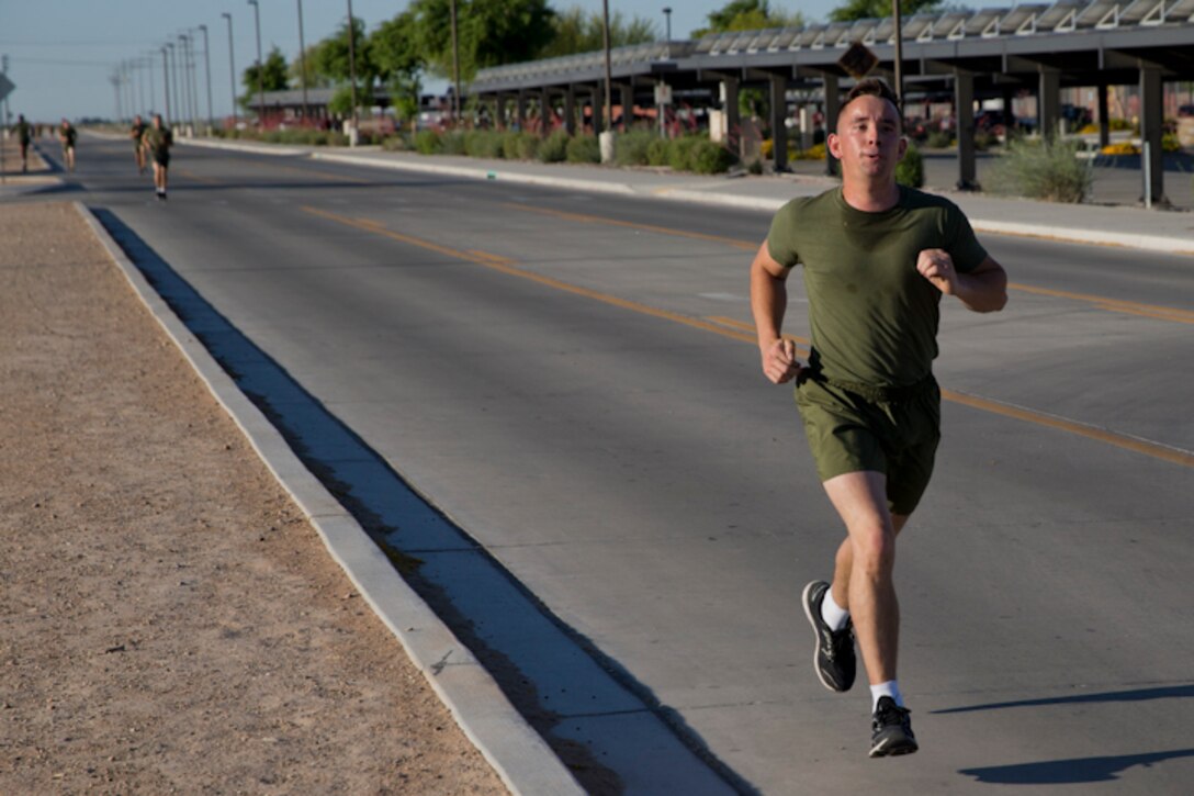 U.S. Marines with Headquarters and Headquarters Squadron, Marine Corps Air Station Yuma, conduct the pull-up portion of the Physical Fitness Test (PFT) at Marine Corps Air Station Yuma Ariz., May 8, 2019. The PFT is an annual requirement for all Marines, and consists of pull-ups, crunches, and a 3 mile run. (U.S. Marine Corps photo by Lance Cpl. Joel Soriano)