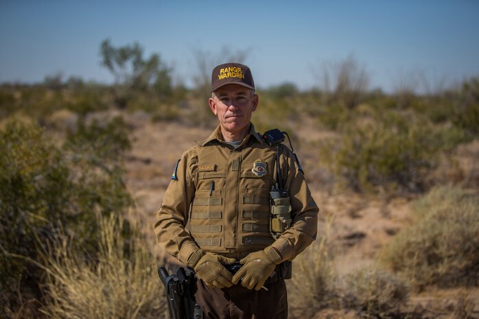 Richard Cerka, a Conservation Law Enforcement Officer with Marine Corps Air Station (MCAS) Yuma, poses for a portrait style photo on ranges owned by MCAS Yuma, May 8, 2019. The Conservation staff is responsible for all areas of wildlife management and recreation on all 1.2 million acres of MCAS Yuma ranges. (U.S. Marine Corps photo by Pfc. John Hall)