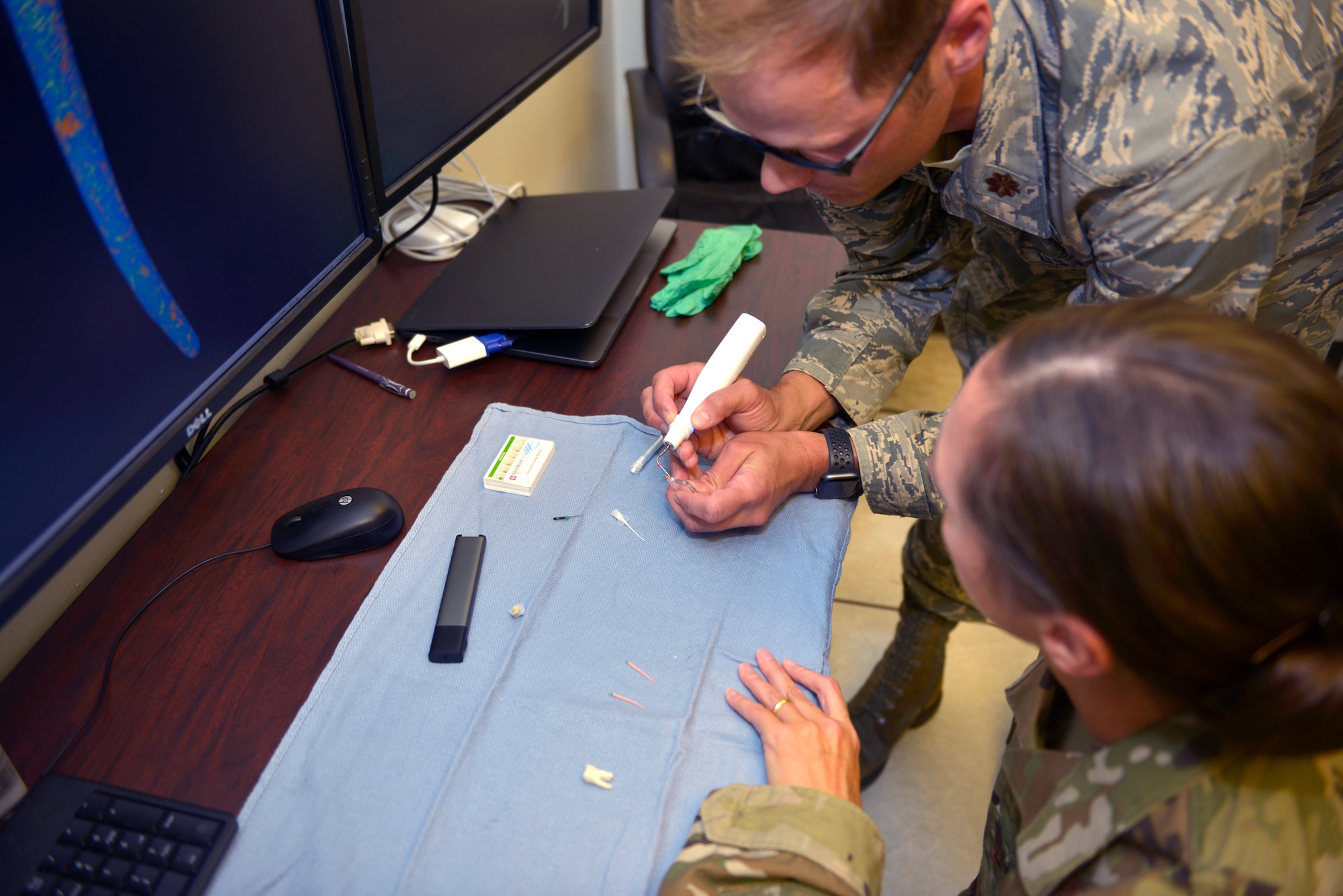 Maj. Timothy Carlson, 81st Dental Squadron endodontic resident, demonstrates a root canal to Col. Heather Blackwell, 81st Training Wing commander, at the Keesler Dental Clinic at Keesler Air Force Base, Mississippi, June 11, 2019. Blackwell toured the Keesler Medical Center to become familiar with the 81st Medical Group's mission and capabilities. (U.S. Air Force photo by Airman Seth Haddix)