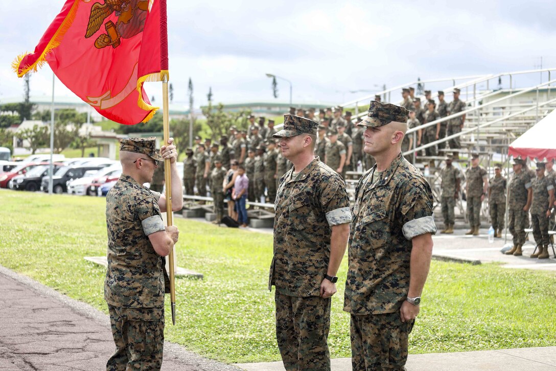 U.S. Marine Corps Lt. Col. Robert D. Wolfe II salutes U.S. Marine Corps Lt. Col. Kevin M. Chunn during a change of command ceremony June 4, 2019 on Camp Kinser, Okinawa, Japan. Chunn, a native of Bernalillo, New Mexico, relinquished command of 3rd Supply Battalion, Combat Logistics Regiment 35, 3rd Marine Logistics Group, to Wolfe II, a native of Columbus, Mississippi, during the ceremony. (U.S. Marine Corps photo by Cpl. Joshua S. Pinkney)