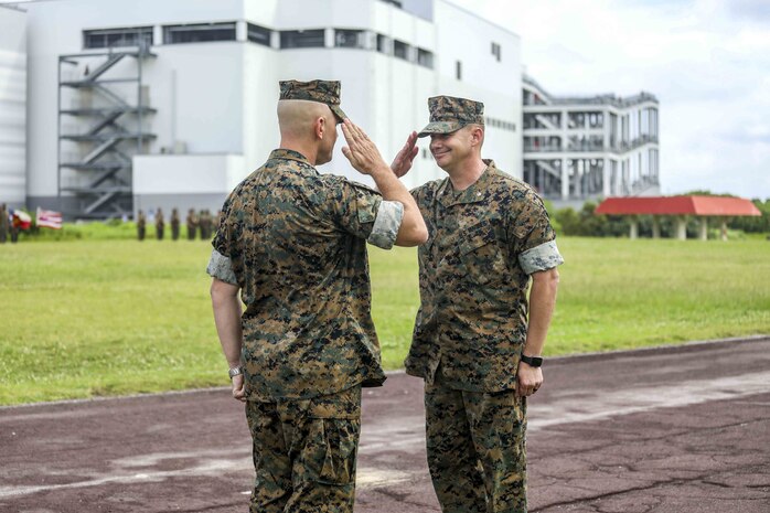 U.S. Marine Corps Lt. Col. Robert D. Wolfe II salutes Lt. Col. Kevin M. Chunn during a change of command ceremony June 4, 2019 on Camp Kinser, Okinawa, Japan. Chunn, a native of Bernalillo, New Mexico, relinquished command of 3rd Supply Battalion, Combat Logistics Regiment 35, 3rd Marine Logistics Group, to Wolfe II, a native of Columbus, Mississippi, during the ceremony. (U.S. Marine Corps photo by Cpl. Joshua S. Pinkney)