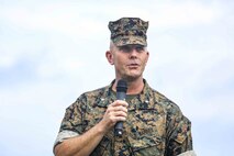 Lt. Col. Robert D. Wolfe II addresses Marines, Sailors and guests during a change of command ceremony June 4, 2019 on Camp Kinser, Okinawa, Japan. Lt. Col. Kevin M. Chunn, a native of Bernalillo, New Mexico, relinquished command of 3rd Supply Battalion, Combat Logistics Regiment 35, 3rd Marine Logistics Group, to Wolfe II, a native of Columbus, Mississippi, during the ceremony. (U.S. Marine Corps photo by Cpl. Joshua S. Pinkney)