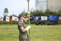 U.S. Marine Corps Staff Sgt. Kady Miller leads the III Marine Expeditionary Force Band during a change of command ceremony June 4, 2019 on Camp Kinser, Okinawa, Japan. Lt. Col. Kevin M. Chunn, a native of Bernalillo, New Mexico, relinquished command of 3rd Supply Battalion, Combat Logistics Regiment 35, 3rd Marine Logistics Group, to Lt. Col. Robert D. Wolfe II, a native of Columbus, Mississippi, during the ceremony. Miller, the drum major of the III MEF Band, is a native of Phelan, California. (U.S. Marine Corps photo by Cpl. Joshua S. Pinkney)