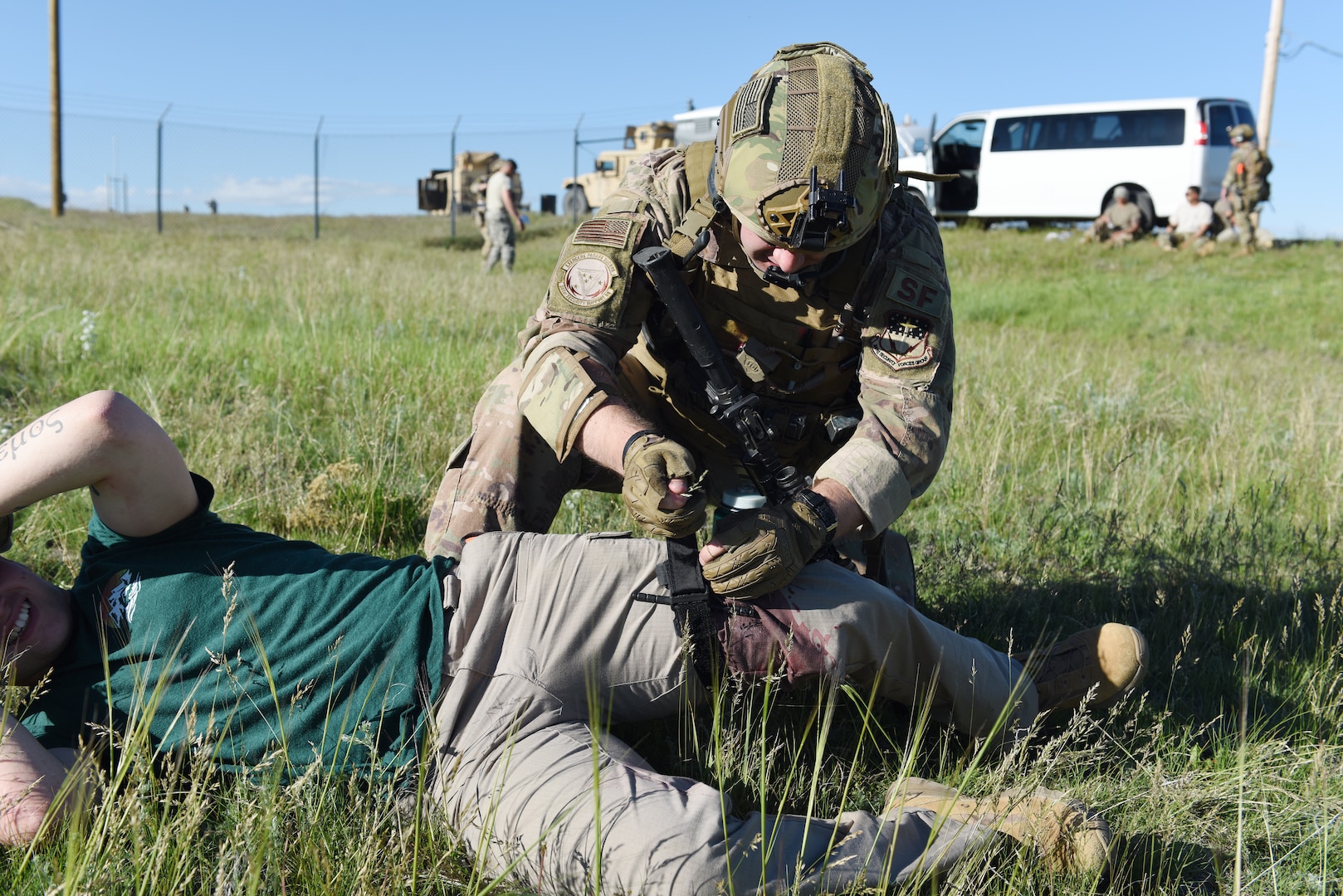 An Airman with the 341st Security Support Squadron tactical response force provides Tactical Combat Casualty Care during an integrated recapture and recovery exercise June 11, 2019, at an intercontinental ballistic missile launch facility near Simms, Mont.