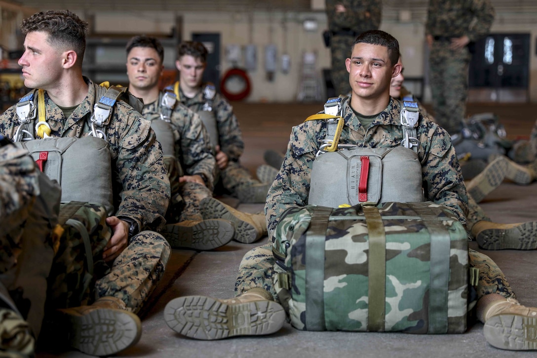 U.S. Marine Corps air delivery specialists prepare to board MV-22 Ospreys for an air delivery exercise June 6, 2019 on Marine Corps Air Station, Okinawa, Japan. Air delivery specialists with Air Delivery Platoon, Landing Support Company, 3rd Transportation Support Battalion, Combat Logistics Regiment 3, 3rd Marine Logistics Group, employed the Joint Precision Airdrop System to enhance mission readiness by providing hands-on rehearsals. The JPADS is an autonomous system designed to provide accurate delivery of cargo and supplies to ground component forces. (U.S. Marine Corps photo by Lance Cpl. Mark Fike)
