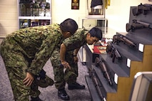 Japanese Ground Self-Defense Force Soldiers examine World War II era weapons during a community exchange program tour on Camp Kinser, Okinawa, Japan June 7, 2019. During the tour, hosted by Combat Logistics Regiment 35, service members visited the base dining facility, supply management unit, a maintenance shop and the Battle of Okinawa historical display, before taking part in a social at the USO. The purpose of the program is to create bonds and increase operational understanding between the JGSDF and the U.S. Marine Corps. (U.S. Marine Corps photo by Pfc. Courtney A. Robertson)