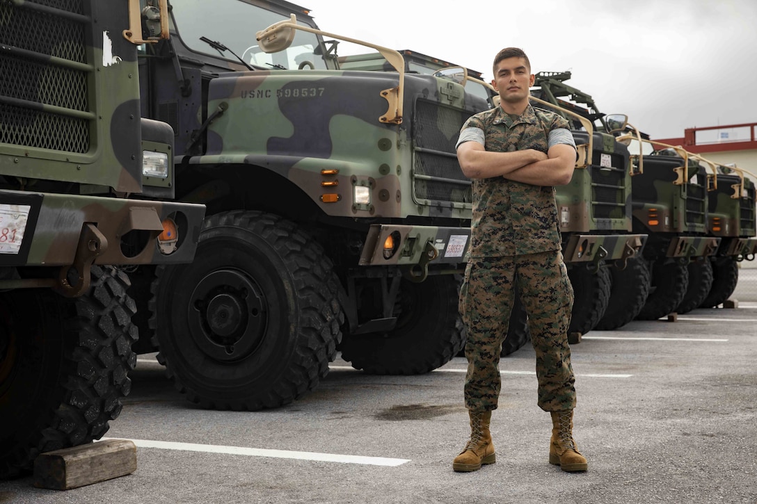 U.S. Marine Corps Cpl. Chad R. Cruz stands in front of an MTVR 7-ton truck at Camp Kinser, Okinawa, Japan on April 23, 2019. Cruz was awarded the Motor Transportation Operator of the Year award for his hard work and enthusiasm as a motor transportation operator. Cruz, a native of Ewa Beach, Hawaii, is with Headquarters and Service Company, 3rd Supply Battalion, Combat Logistics Regiment 35, 3rd Marine Logistics Group. (U.S. Marine Corps photo by Lance Cpl. Armando Elizalde)