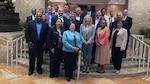 A group photo of DLA and DoD information technology professionals meeting to share business system practices efficiencies.