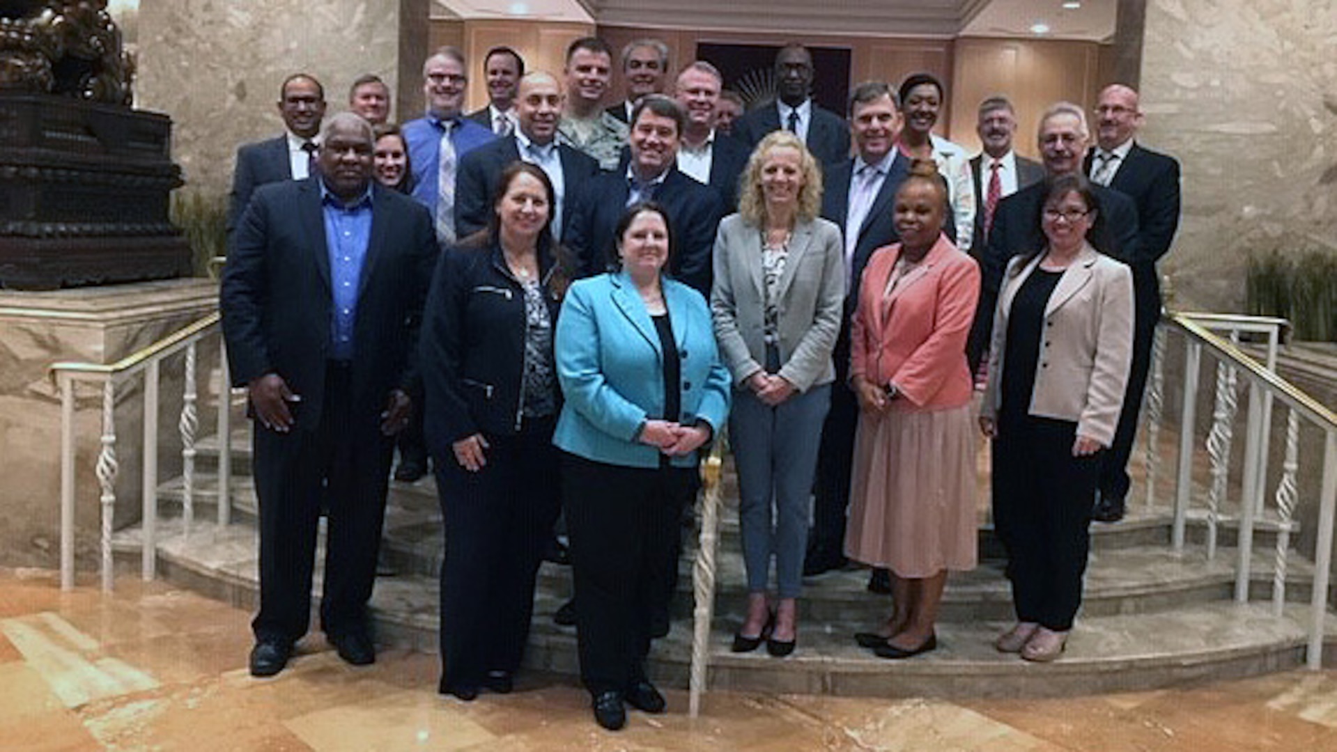 A group photo of DLA and DoD information technology professionals meeting to share business system practices efficiencies.