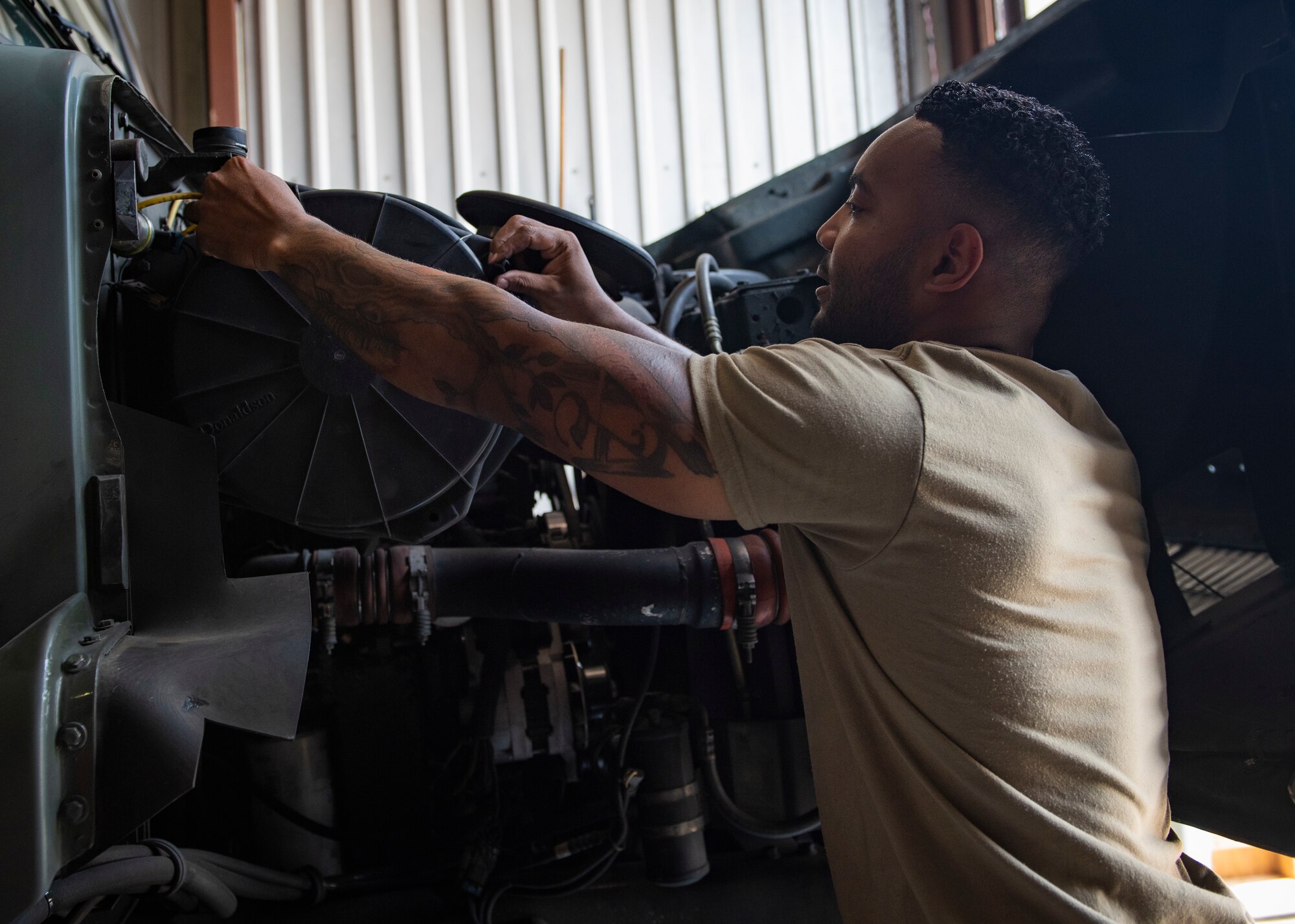 U.S. Air Force Staff Sgt. Akeem Anderson, vehicle mechanic assigned temporarily assigned to the 325th Logistics Readiness Squadron, performs preventative maintenance on a refueling truck June 4, 2019, at Tyndall Air Force Base, Florida.