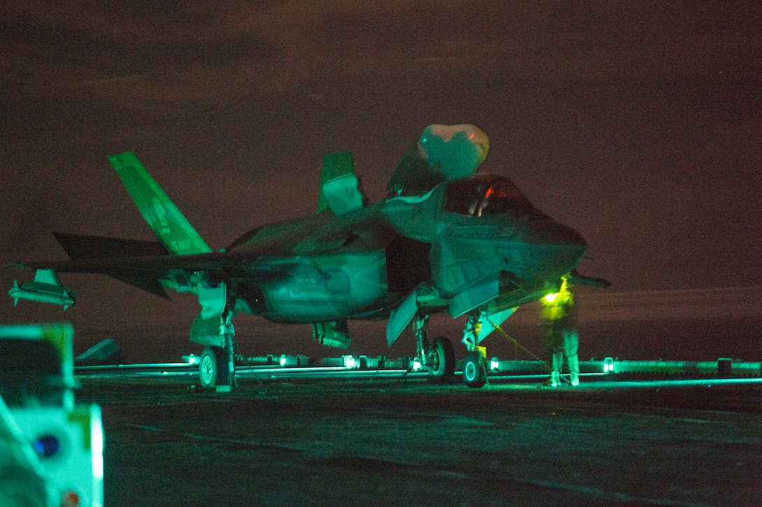Marines with Marine Medium Tiltrotor Squadron 265 aboard the USS Wasp work on an F-35B Lightning II fighter aircraft during night time flight operations while underway in the Philippine Sea, June 9, 2019. The 31st Marine Expeditionary Unit, the Marine Corps` only continuously forward-deployed MEU, provides a flexible and lethal force ready to perform a wide range of military operations as the premier crisis response force in the Indo-Pacific region.