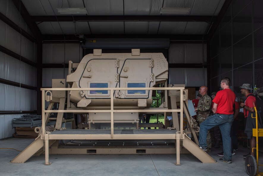 U.S. Air Force Junior ROTC cadets watch as fellow flight members experience a simulated Humvee roll-over as part of the Cadet Leadership Course June 4, 2019, at the Illinois Army National Guard Training Complex in Sparta Ill. The simulation is nicknamed, "The Heat" and the goal of the simulation is to teach participants to exit a rolled over vehicle without panicking. (U.S. Air Force photo by Senior Airman Daniel Garcia)