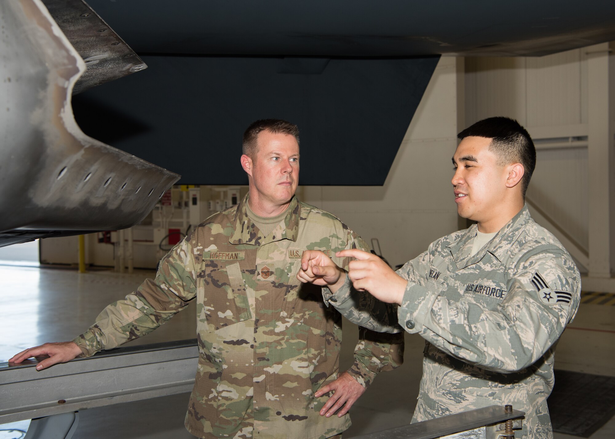 Senior Airman Ryan Ruelan, a low-observable maintenance Airman with the 509th Maintenance Squadron, explains the tailpipe assembly of the B-2 Spirit to Chief Master Sgt. Charles R. Hoffman, the command chief of Air Force Global Strike Command from Barksdale Air Force Base, Louisiana, on June 11, 2019, at Whiteman Air Force Base, Missouri. Ruelan also told Hoffman about his other roles and responsibilities in addition to the tailpipe assembly and the role LO has with it. (U.S. Air Force Photo by Airman 1st Class Parker J. McCauley)
