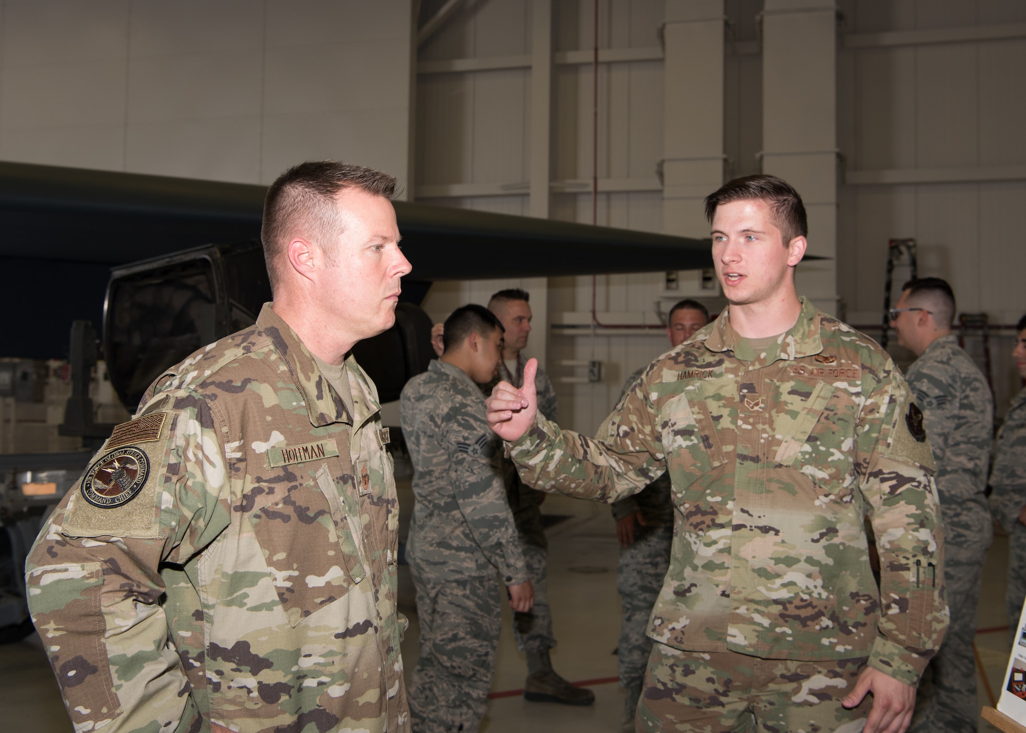 Chief Master Sgt. Charles R. Hoffman, the command chief of Air Force Global Strike Command from Barksdale Air Force Base, Louisiana, listens to a low-observable maintenance Airman with the 509th Maintenance Squadron, on June 11, 2019, at Whiteman Air Force Base, Missouri. During the tour Hoffman learned about the role of LO Airmen and keeping the B-2 Spirit stealthy. (U.S. Air Force Photo by Airman 1st Class Parker J. McCauley)