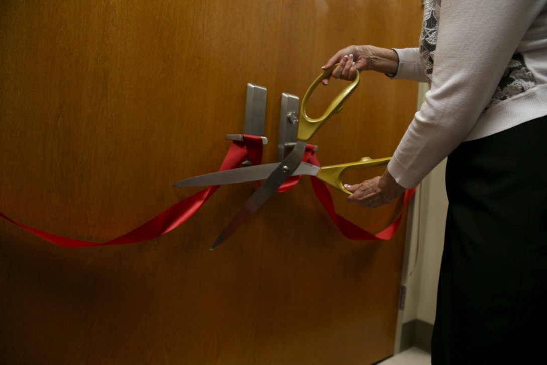 Jude Weston Step Mother of Maj. Michael E. Weston cut the ribbon off the doors to officially open the courtroom during the dedication ceremony for her stepson Maj. Michael Weston at the Marine Corps Recruit Depot Parris Island, S.C. June 11, 2019. Marines, Family, and friends gathered at the ceremony to pay Homage to the Marine by dedicating a court room to him.