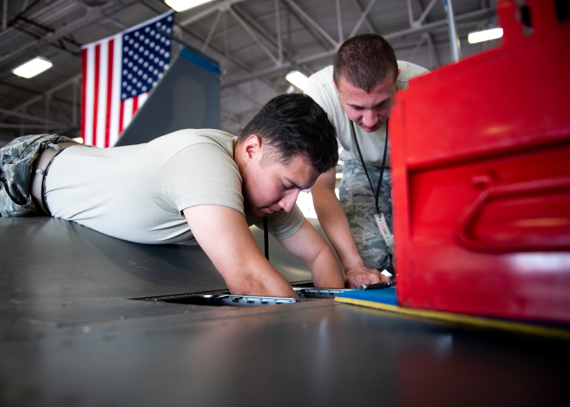 Airman 1st Class Christopher Corso and Airman 1st Class Ryan Sandoval, 364th Training Squadron electrical and environmental systems apprentice course students, remove and install a bleed air check valve at Sheppard Air Force Base, Texas, June 14, 2019. The valve prevents reverse air flow if one of the engines aren't functioning properly and keeps the air flowing all in one direction. Preferably to the flight-deck to regulate air pressure. (U.S. Air Force photo by Airman 1st Class Pedro Tenorio)