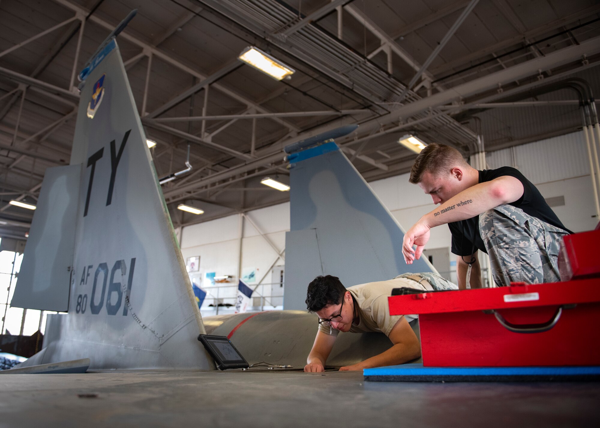 Airman Grantham Dorriety, left, and Airman Gregory Herrera, 364th Training Squadron electrical and environmental systems apprentice course students, remove a backup bleed air valve at Sheppard Air Force Base, Texas, June 14, 2019. The backup bleed air valve controls the air pressure for the air conditioning unit in the flight-deck, without proper air pressure the pilot could pass out. Once the students remove the valve they will learn how to re-install it. (U.S. Air Force photo by Airman 1st Class Pedro Tenorio)