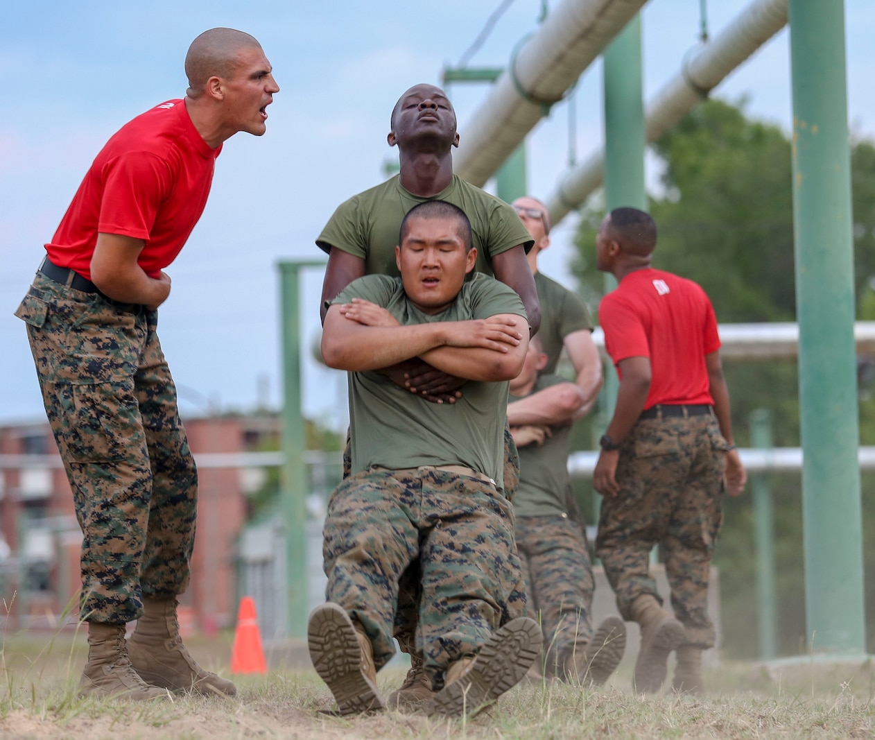 Recruits with Bravo Company, 2nd Recruit Training Battalion, complete numerous challenges during the Obstacle Course on Marine Corps Recruit Depot Parris Island, South Carolina, May 30, 2019. This event is comprised of various obstacles and is designed to help recruits build confidence by overcoming physical challenges. (U.S. Marine Corps photo by Lance Cpl. Dylan Walters)