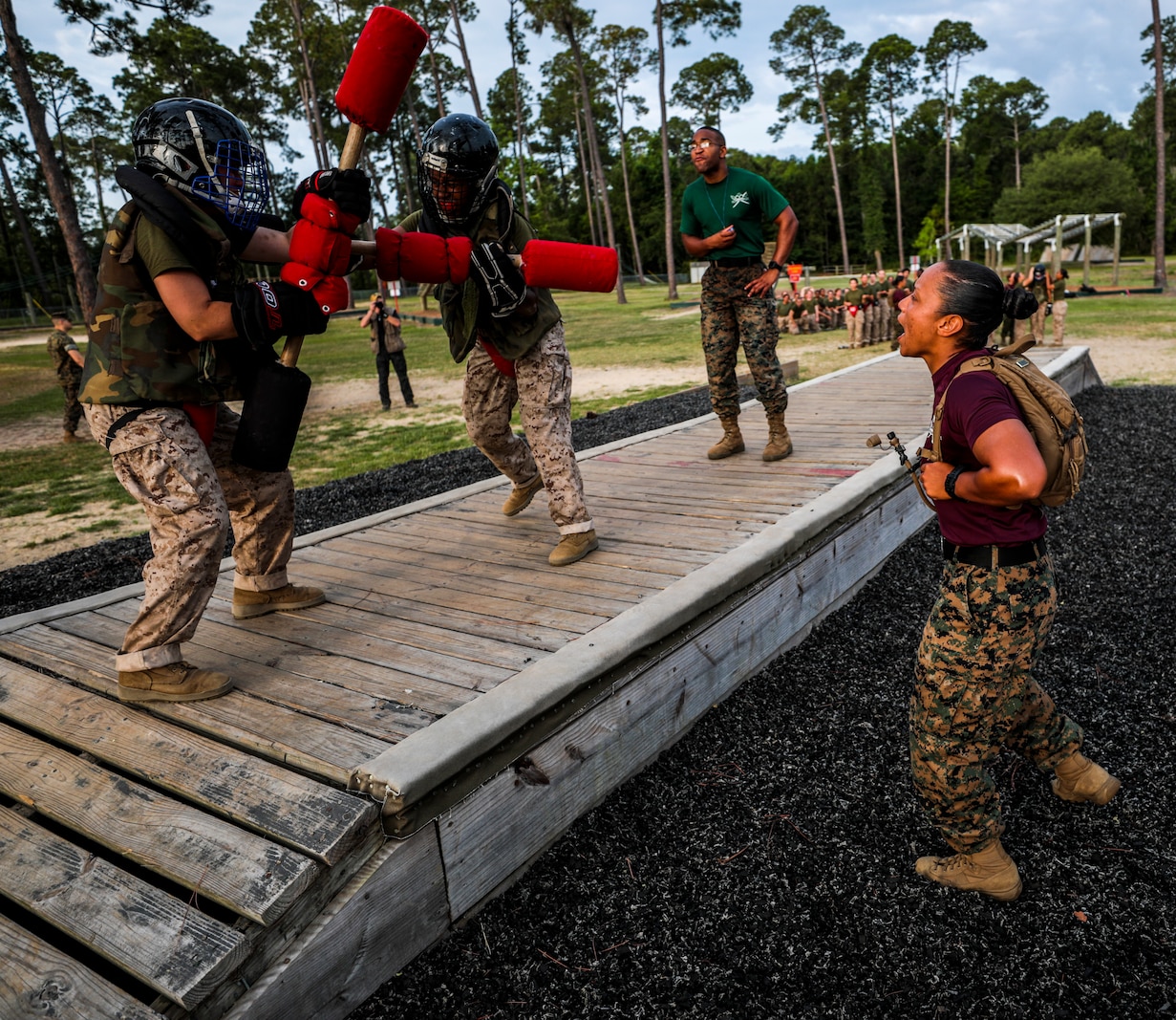 Recruits with Papa Company, 4th Recruit Training Battalion, engage pugil sticks at Marine Corps Recruit Depot Parris Island, S.C., May 31, 2019. Body sparring and pugil sticks help recruits apply the fundamentals of Marine Corps martial arts. (U.S. Marine Corps Photo by Cpl. Andrew Neumann)