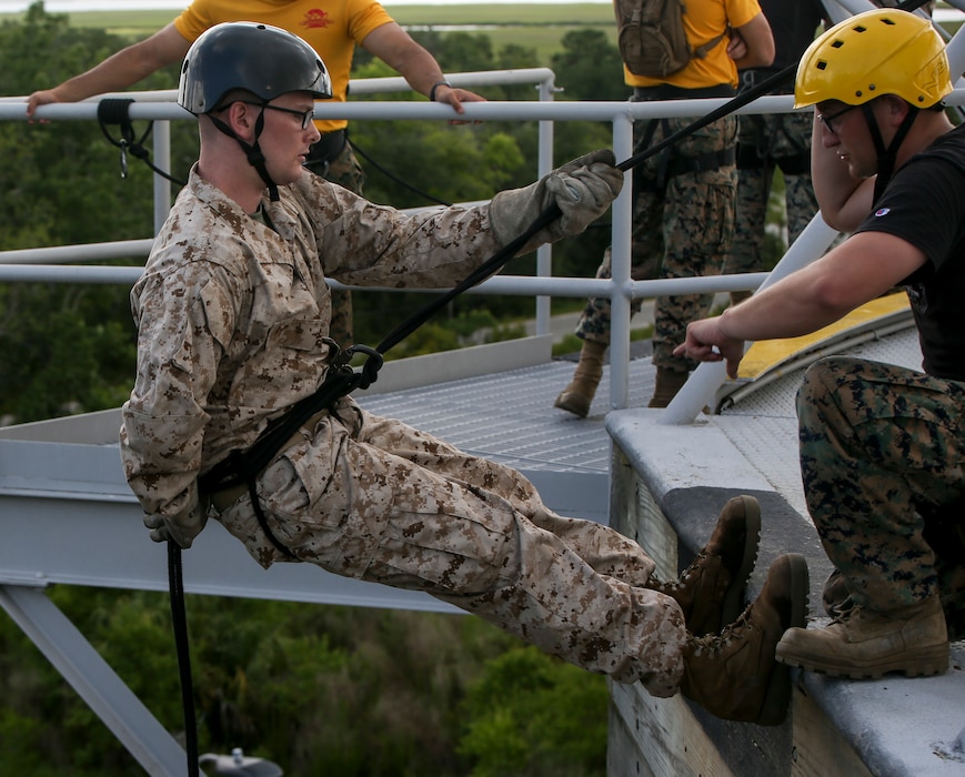 A recruit with Fox Company, 2nd Recruit Training Battalion, practices rappelling on Marine Corps Recruit Depot Parris Island, S.C., June 10, 2019. Recruits rappel from the 47-foot-tall tower wearing a safety harness, helmet and gloves to gain confidence and overcome any fear of heights. (U.S. Marine Corps photo by Pfc. Michelle Brudnicki/Released)