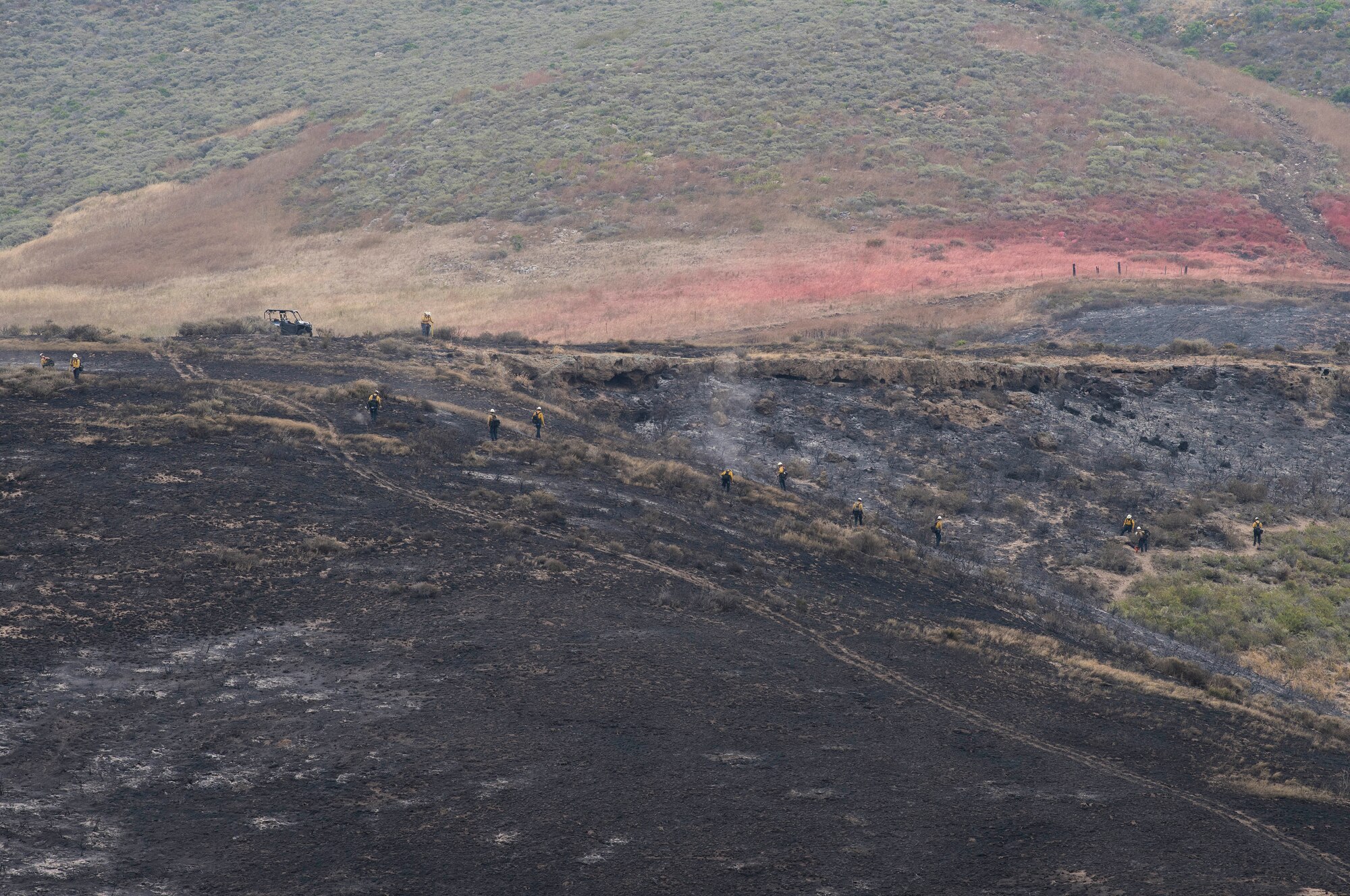 30th Space Wing firefighters work with the Santa Barbara Fire Department to mitigate the Rancho Fire June 14, 2019, at Vandenberg Air Force Base, Calif. The fire burned approximately 140 acres near Point Sal and El Rancho roads. (U.S. Air Force photo by Airman 1st Class Hanah Abercrombie)