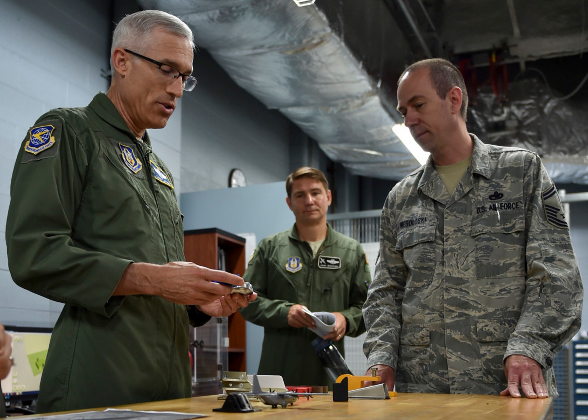 Maj. Gen. Craig L. La Fave, commander of the 22nd Air Force, examines items produced by the 910th Maintenance Squadron’s 3-D printing capabilities in the fabrication shop on Youngstown Air Reserve Station June 2. La Fave visited YARS from June 1 through 3 making his way around the station and receiving briefings from several of the 910th Airlift Wing’s squadrons on how they provide a current, qualified, mission-ready force so the Air Force can fly, fight and win in air, space and cyberspace. (U.S. Air Force photo/Airman 1st Class Noah J. Tancer)