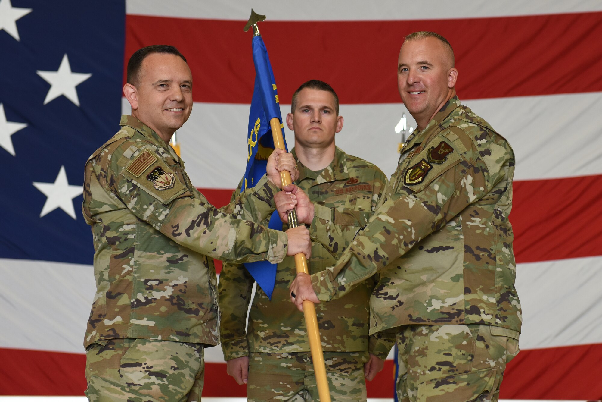 Maj. Michael Bergeron, right, accepts command of the 741st Maintenance Squadron from Col. Nathan Mitchell, 341st Maintenance Group commander during a change of command ceremony June 14, 2019, at Malmstrom Air Force Base, Mont.