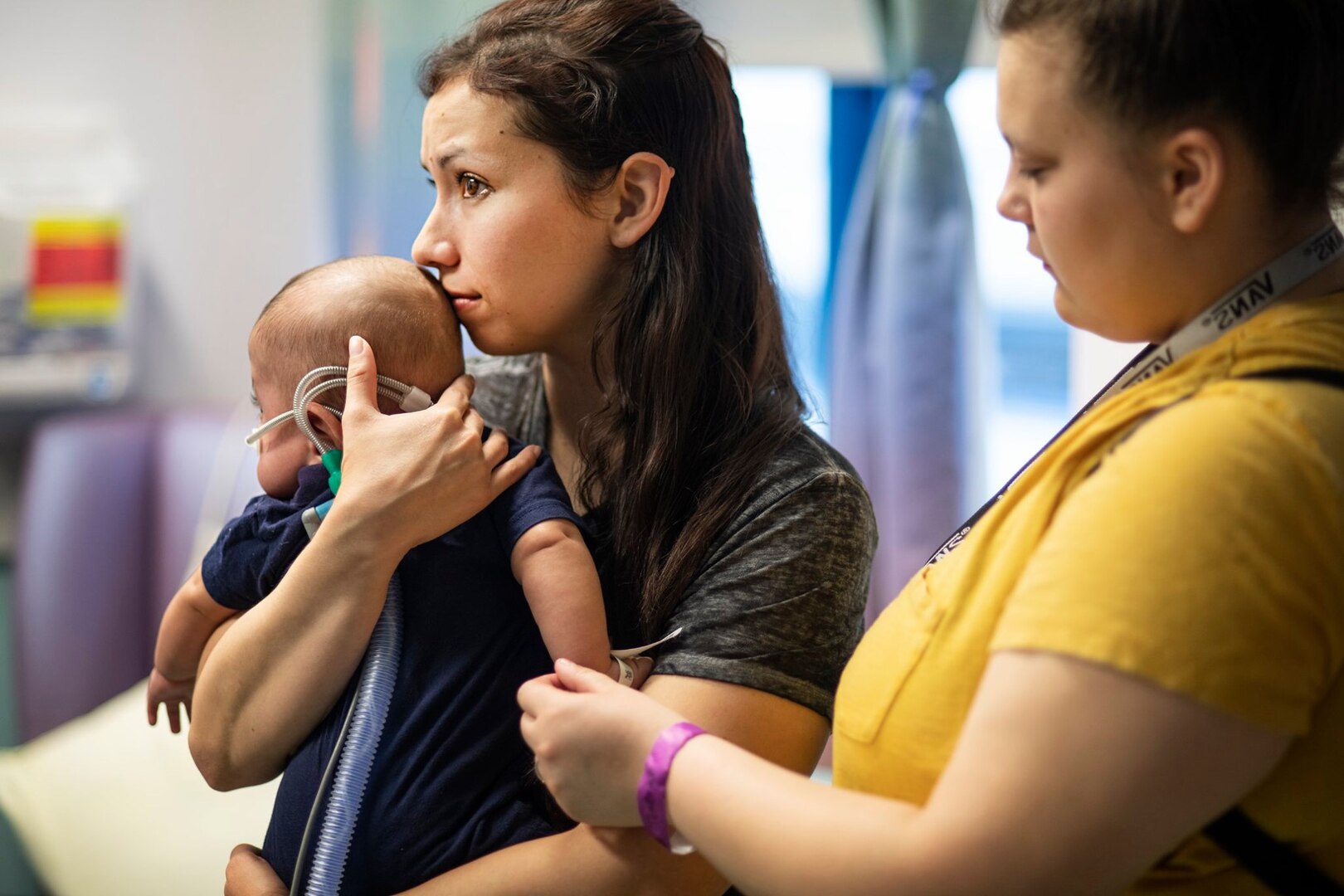 Kaitlyn Crawford holds her 7-month-old son, Nakoa, at the Children’s Medical Center of Dallas, June 7, 2019. Critical air transport team members explained the process of transferring her son to the Balboa Naval Medical Center in San Diego via C-130 Hercules.