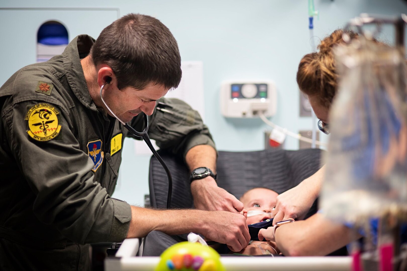 Maj. (Dr.) Thomas Lee, 59th Medical Wing critical care air transport team pediatrician, checks the pulse of 7-month-old patient, Nakoa Crawford, at the Children’s Medical Center of Dallas, June 7, 2019. Crawford was born in Dallas at 25 weeks and has been in critical care ever since. Last week, he was determined to be stable enough for Lee and his team to fly him and his mother home to San Diego.