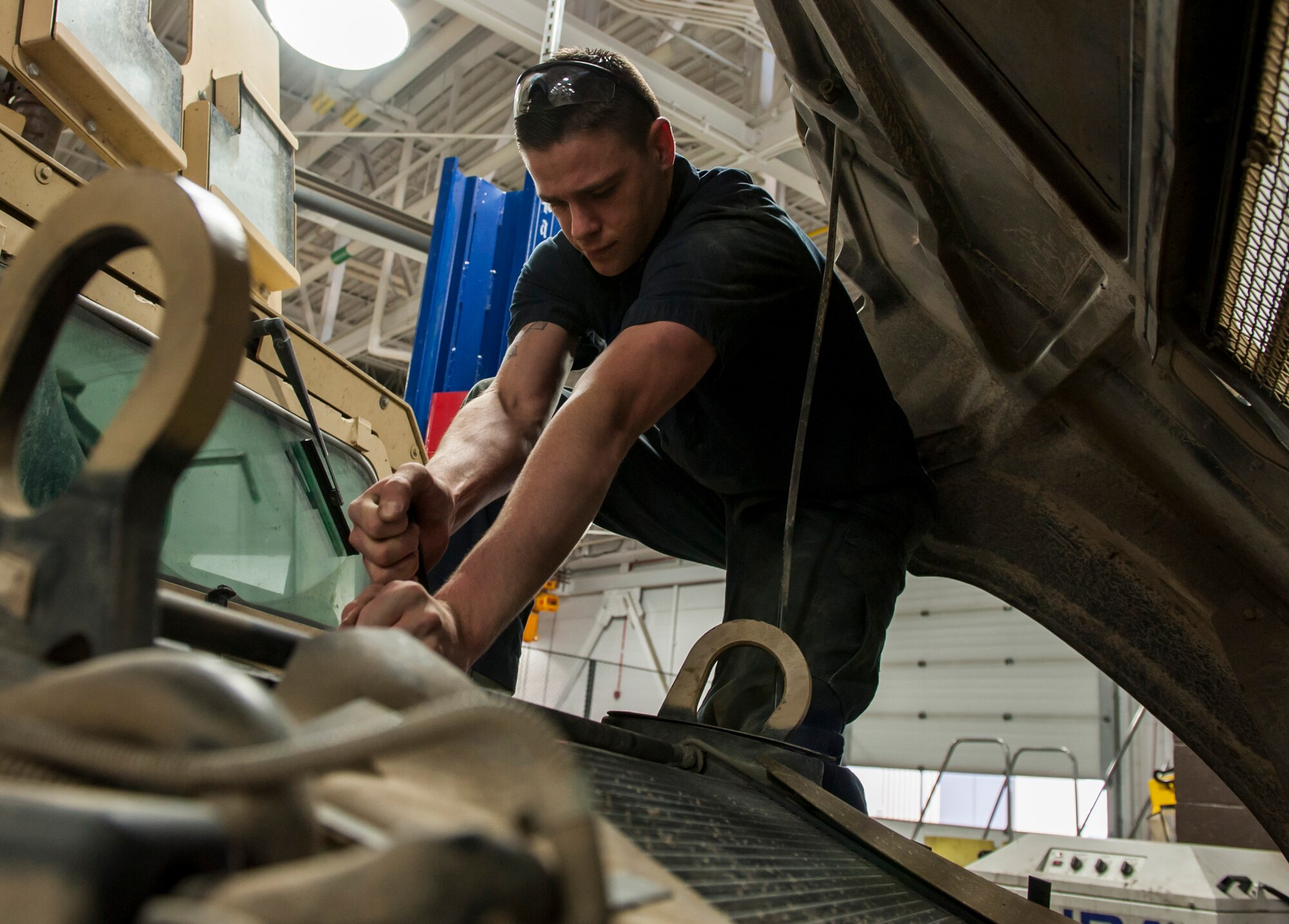 Senior Airman Connor Atwood, 341st Logistics Readiness Squadron vehicle maintenance journeyman, performs routine repairs on a Humvee June 11, 2019, at Malmstrom Air Force Base, Mont.